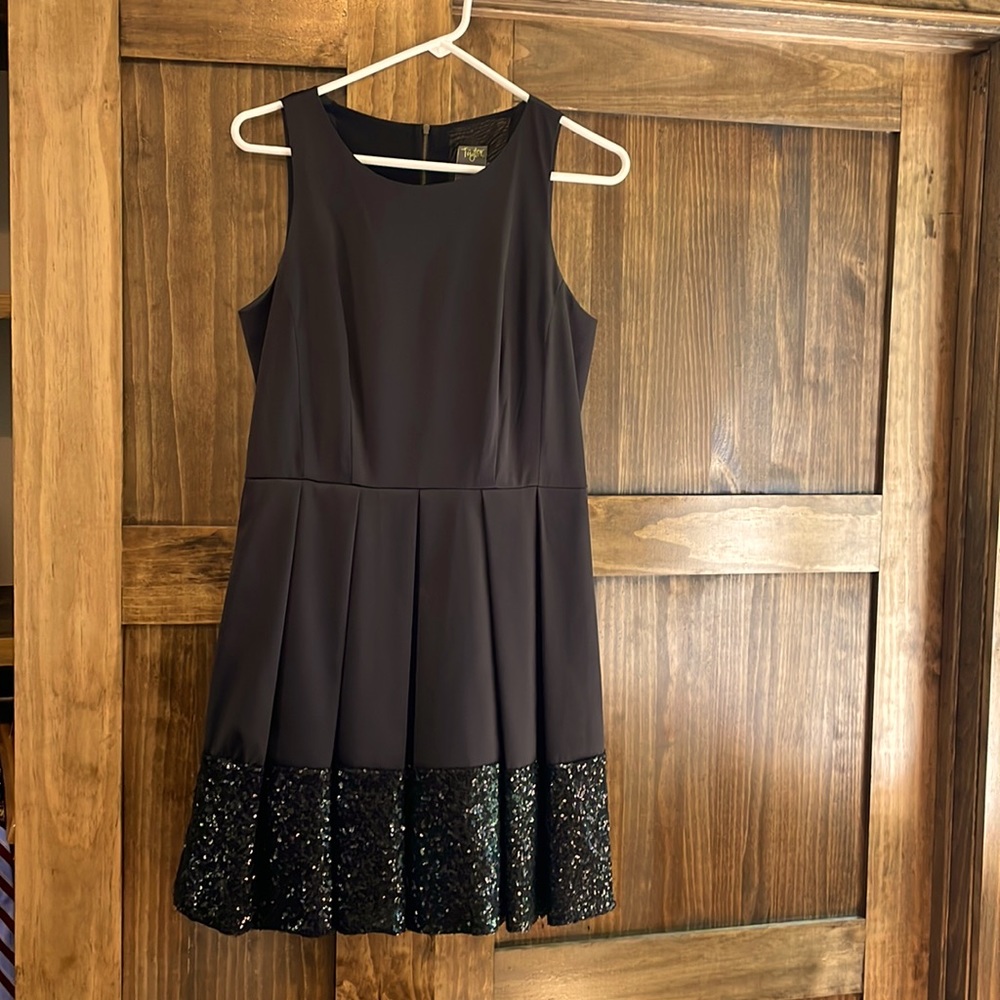 Black cocktail dress. Size 8. Sequins on bottom. Party Dress!